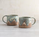 Pottery For The Poles Mugs