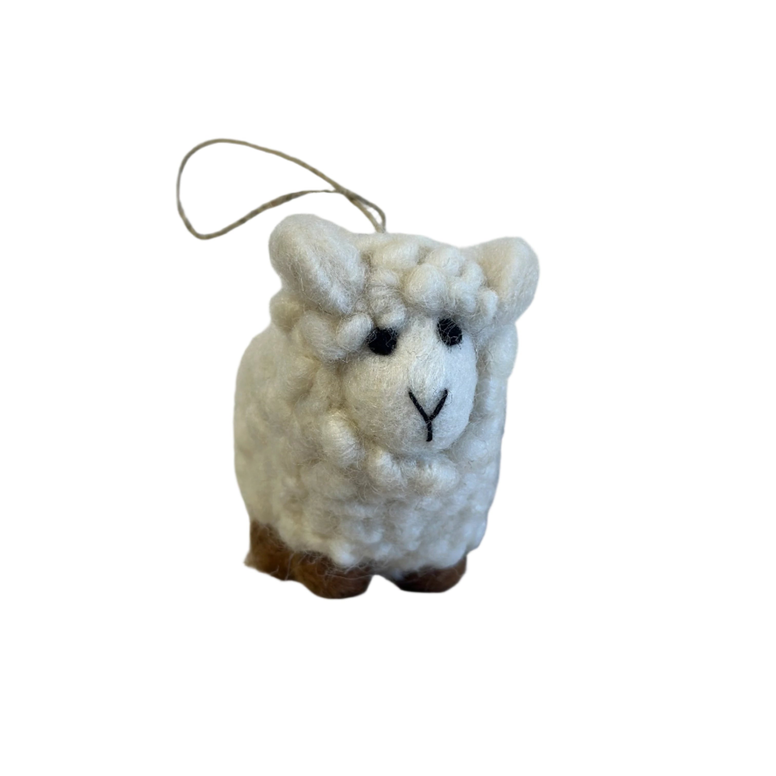 Small white sheep plush toy peeking out from behind a white wall